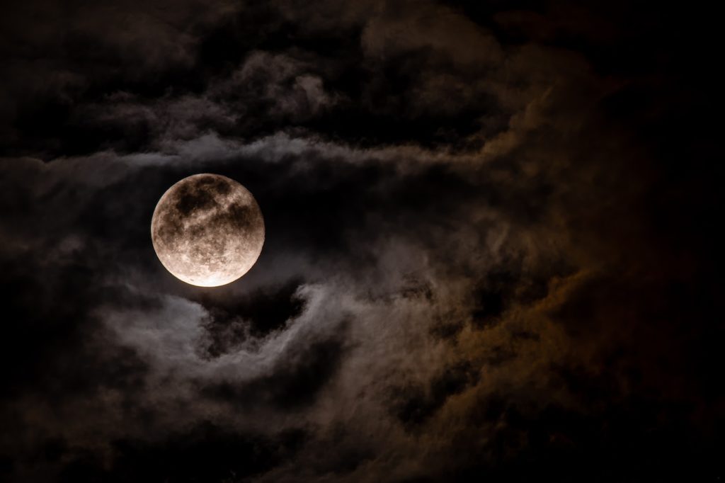 Moon in cloudy sky